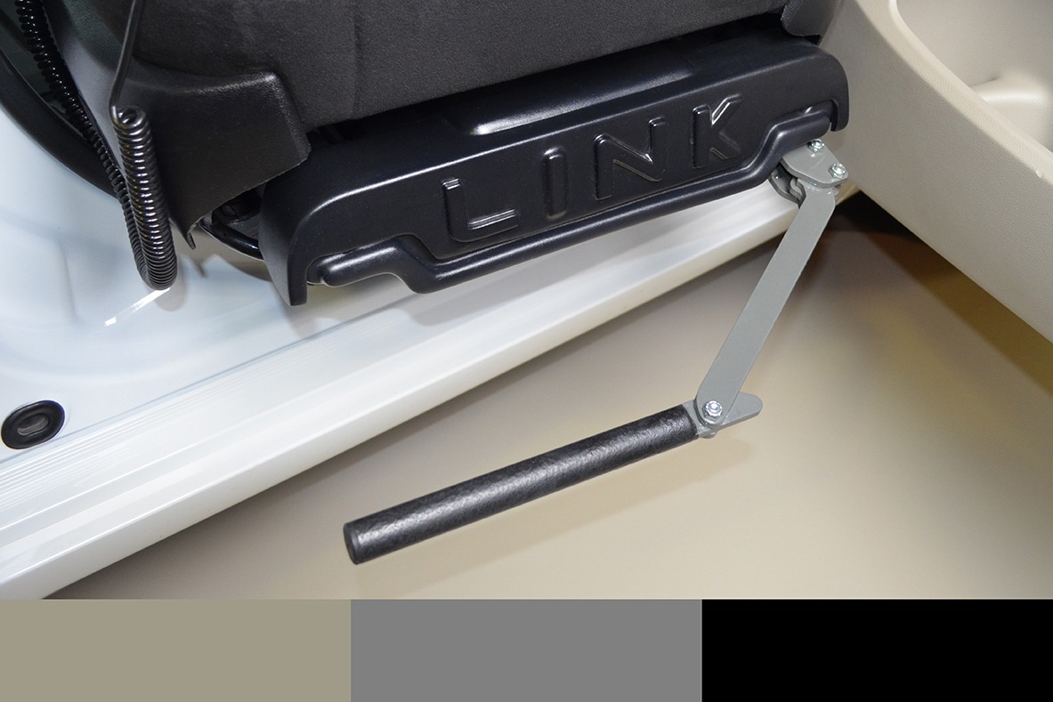 A metal hinge attached to a plastic rod is a attached under a LINK turning seat base. This is the optional footrest.